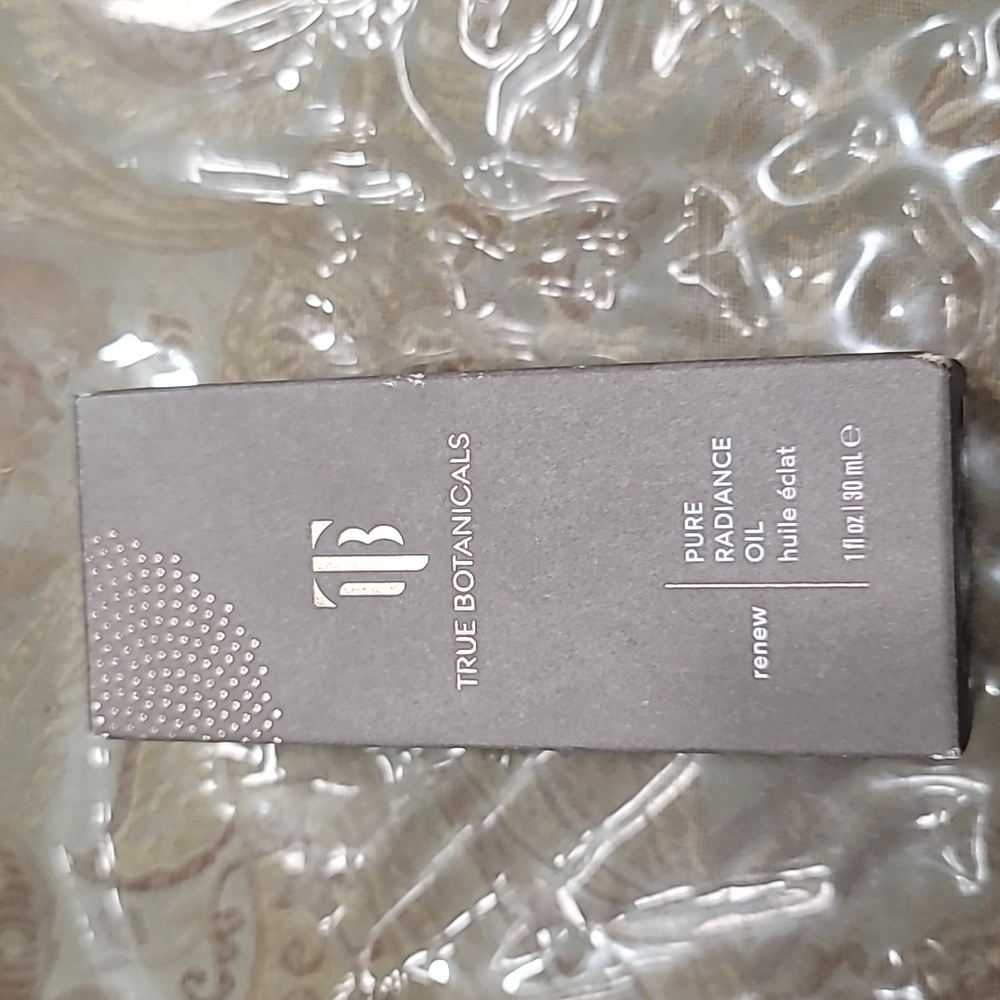 True Botanicals Pure Radiance Oil and a Gua Sha face tool